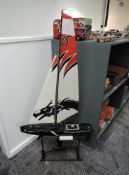 A modern Joyways Dragon Force radio controlled model Racing Yacht, on stand, missing remote control