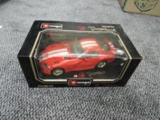 A Burago 118 scale diecast, Dodge Viper GTS Coupe, on stand in original box
