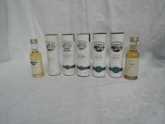 Seven Miniature bottles of Bowmore Islay Single Malt Whisky, 10 year old 43% vol in tube, Darkest
