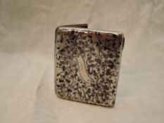 A Russian 84 zolotnik silver cigarette case having black scroll niello decoration and plain