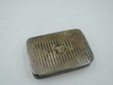 A silver snuff box having engine turned stripe decoration, moulded sides and gilt interior,