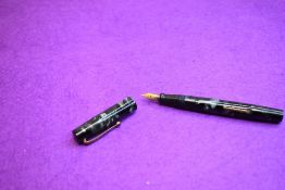 A Mabie Todd & Co Blackbird BB2/42 Self filler Leverfill fountain pen, in blue/grey marble, a