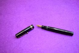 A Mabie Todd Swan Leverless fountain pen in black with two narrow and one broad band to cap having a