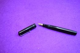 A Mabie Todd Swan Self-filler leverfill fountain pen in black with single narrow band to cap