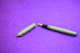 A Mabie Todd & Co Swan Leverless twist filler, in sage green with two narrow and one broad band to