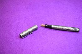 A Mabie Todd Swan SM112 Self-filler leverfill fountain pen in green snake skin having a Swan 2