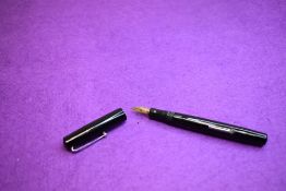 A Mabie Todd & Co Swan Self filler leverfill in black with Swan No2 nib. Approx 13cm