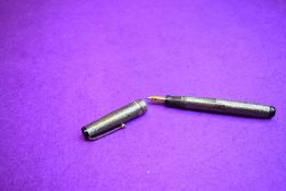 A Mabie Todd Swan L445 Leverless fountain pen in pearl grey lizard skin with two narrow and one