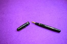 A Mabie Todd & Co Swan 3240 Self Filler Leverfill, in dark green with two bands to the cap and a