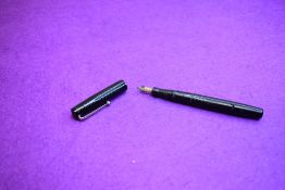 A Mabie Todd & Co Self filler leverfill fountain pen in black with chased design with Swan No1