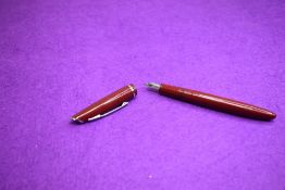 A Platignum leverfill fountain pen in red with single band to cap having Platignum 1st quality