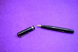 A Mabie Todd & Co Swan Self filler leverfill in black having a single gold band to cap with Swan No2