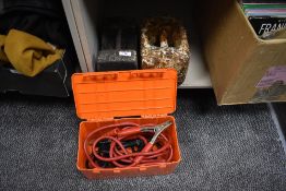 Two large weights and a set of jump leads.