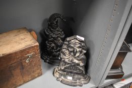 Two novelty door stops in the form of Punch and Judy in cast metal