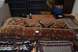 A hand woven and dyed middle eastern style double cushion or pillow