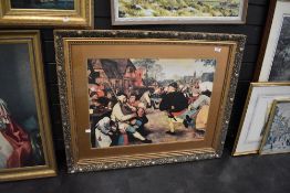 A Dutch style print in a gilt and gesso effect frame