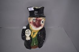 A Staffordshire pottery Toby style jug I'm on the Black List, having damage to rim of jug