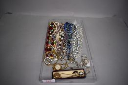 A selection of costume jewellery including pendants, brooches, bracelets etc