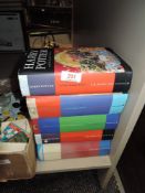 Five JK Rowling Harry potter books.