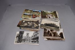 A selection of photographic postcards including local interest and black and white