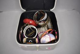 A selection of costume jewellery including bangles and travel case