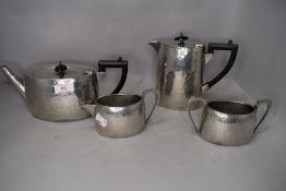 A hand hammered tea set by English Pewter