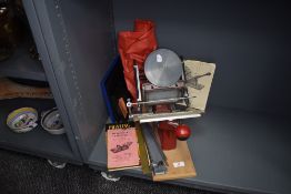An Adana printing machine with accessories