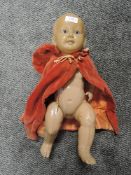 A vintage childrens toy doll