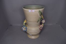 An art deco vase by Clarice Cliff having impressed mark to base
