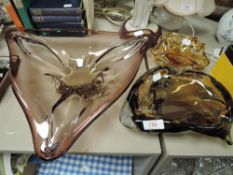 Three heavy pieces of art glass in brown tones.