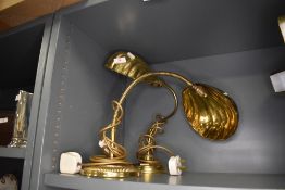 A goose neck brass lamp and similar fixed position having sea shell design shades