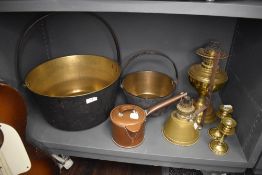 A selection of brass and copper wares including chocolate pot and jam pans