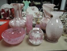 A mixture of pink glass jugs, perfume bottle,bowls and similar.
