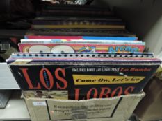 A box full of LP records including easy listening, rock and roll and more.
