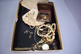 A small selection of costume jewellery including pearls, horn beads, wrist watches etc