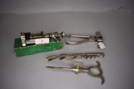 A selection of bar or waiters tools including champagne cork and screw