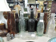 A collection of vintage and antique glass bottles of Penrith interest.