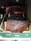 A box of vintage and retro handbags including several Eel skin bags.