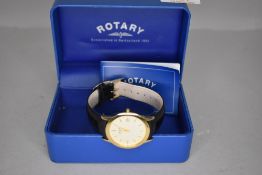 A gent's Rotary quartz wrist watch having baton numeral dial and date aperture to champagne face