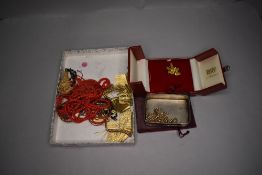A small selection of costume jewellery including cased gold plated Singapore orchid brooch, gold
