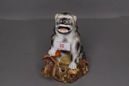 A porcelain dog of fo figure