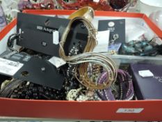 A box full of modern costume jewellery, some items unused, high end brands such as Marks and