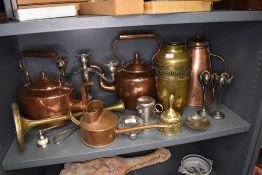 A selection of brass and copper wares including stove kettles and water jug