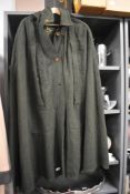 A vintage coney wrap and a green wool cape.