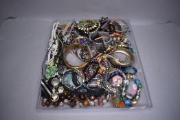 A selection of costume jewellery including wrist watch, necklaces, bracelets and bangles etc