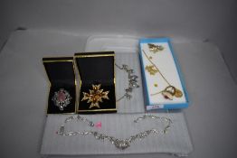 A selection of costume jewellery including leaf style necklaces
