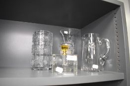 A selection of clear cut crystal glass wares including mid century style vase