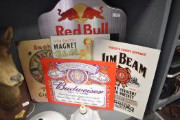 A selection of advertising boards including red bull chalk board