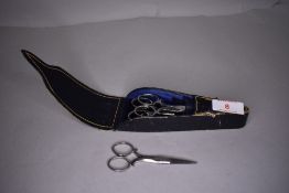 A cased set of graduated Victorian needle work or sewing scissors