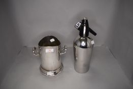 A champagne cooler and a similar soda syphon